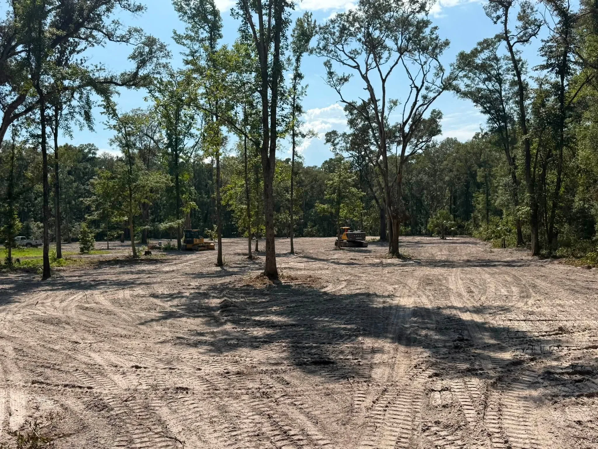 Cleared wooded lot bulldozers lake city FL land clearing